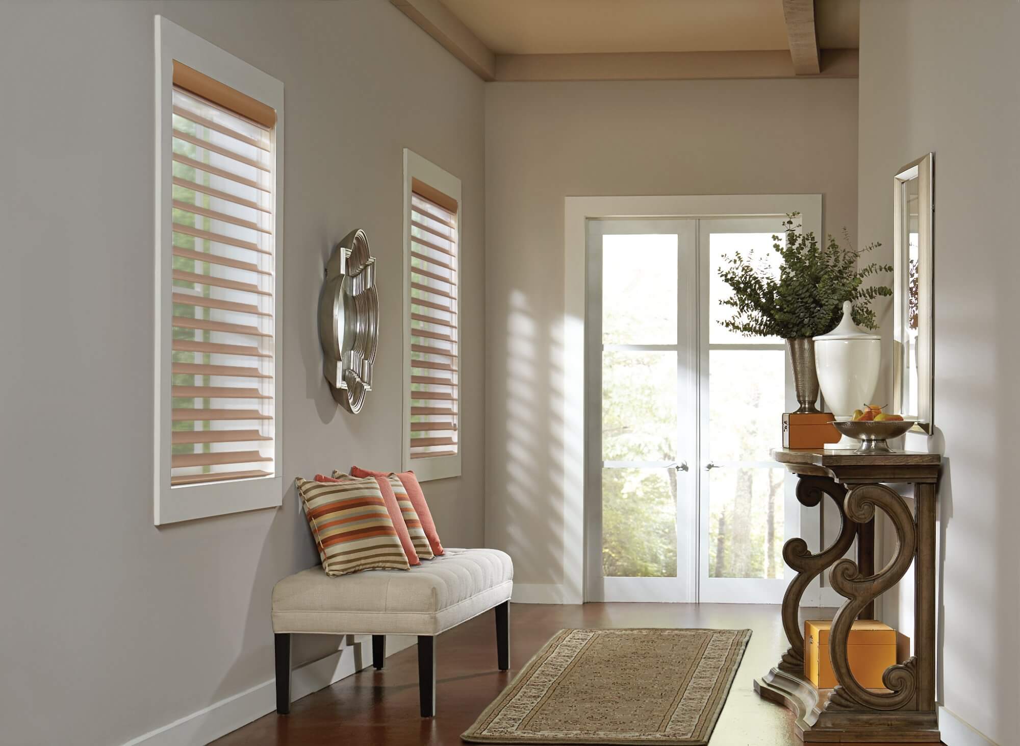 Organize your entryway and try adding elegant window treatments to transom windows to make a great first impression.