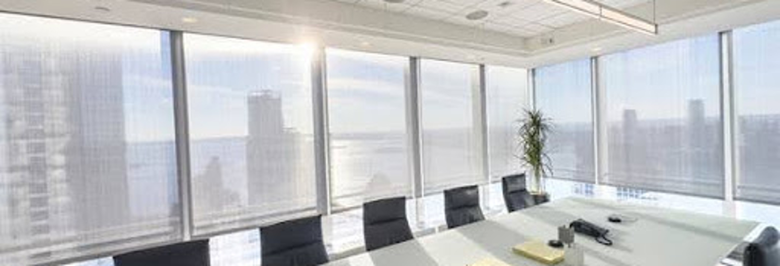 Modern meeting room in an office in a skyscraper | Gotcha Covered
