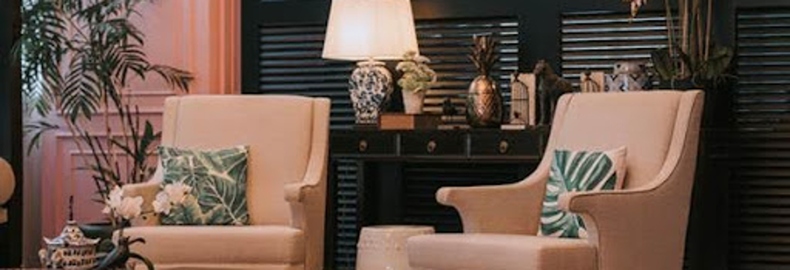 Dark interior shutters with beige chairs | Gotcha Covered