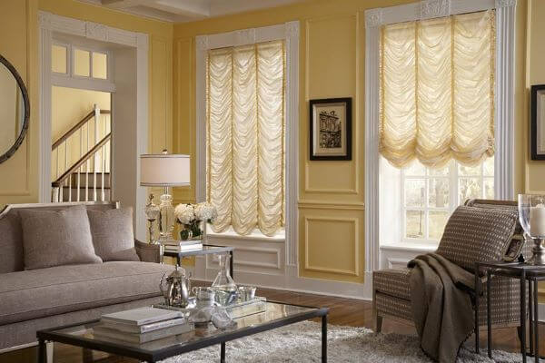Austrian curtains are elaborately pleated curtains with vertical cords spaced evenly across so that when raised, the curtain gathers together.