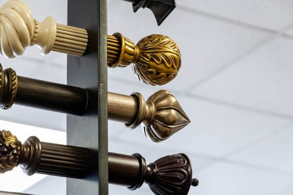 Finials are the decorative end pieces that attach on each side of the window curtain rod. 
