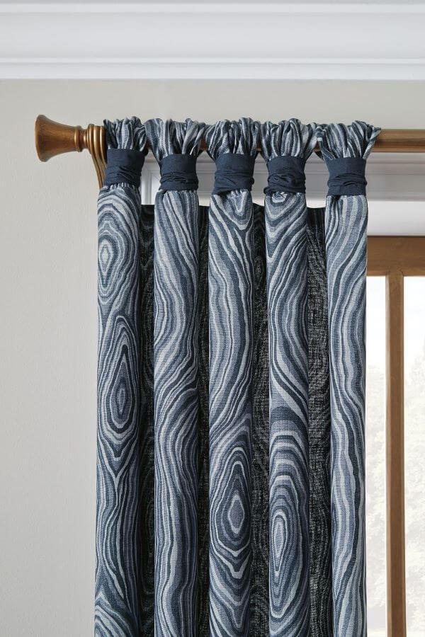 Tab top curtains are a casual heading option that includes fabrics loops spaced across the top of the curtain 