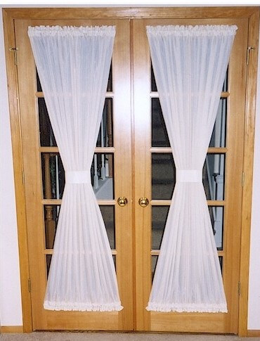 Sash curtains are hung between two sash rods and pulled taut and mounted over a window. Sash curtains are hung between two sash rods and pulled taut and mounted over a window.