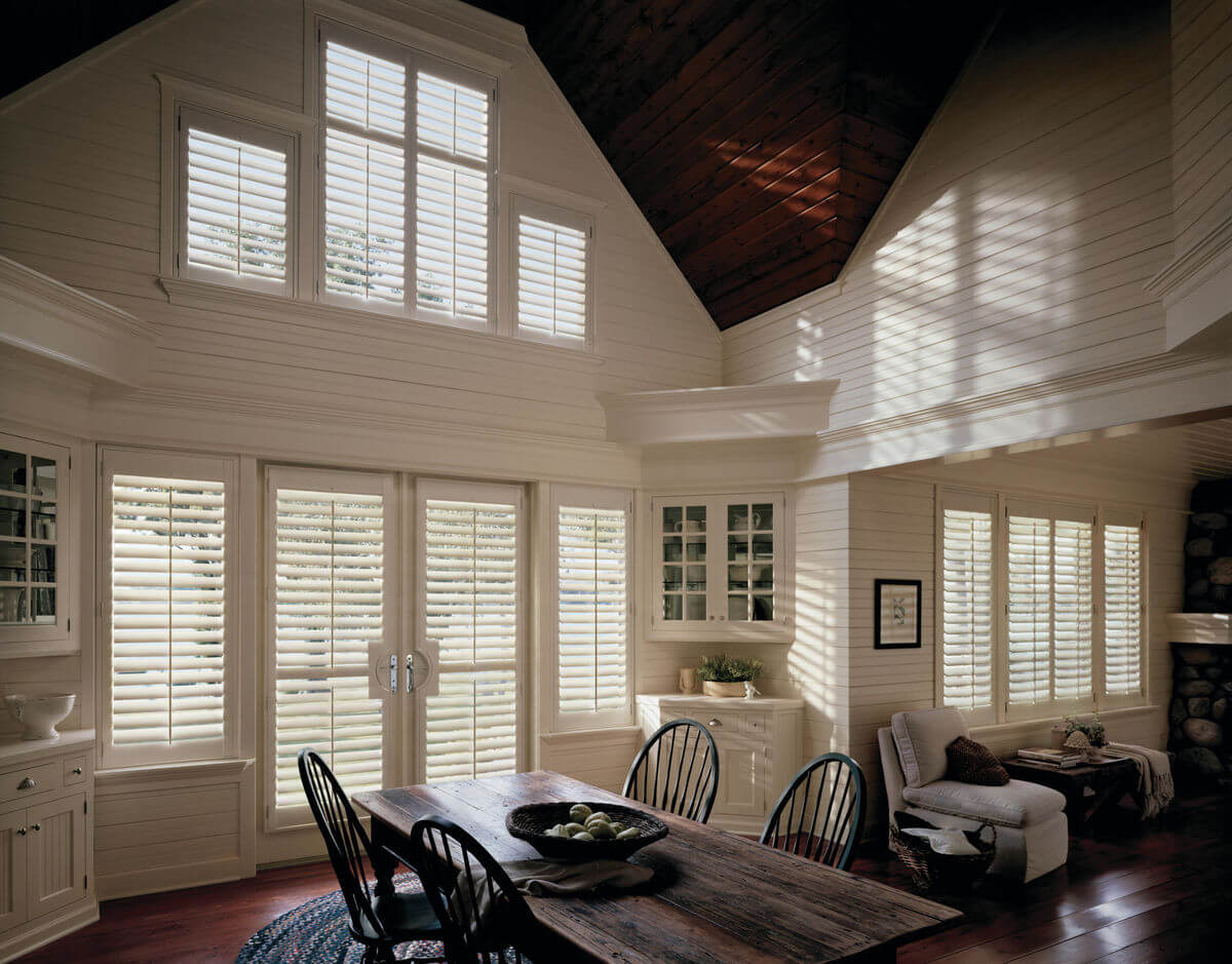 Window treatments should reflect a simple charm and character in farmhouse design styles. 