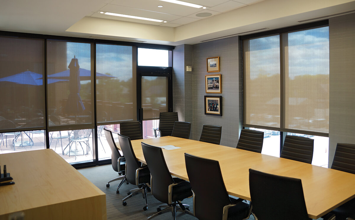 Motorized window treatments are a perfect solution for commercial office spaces to provide optimal light control.