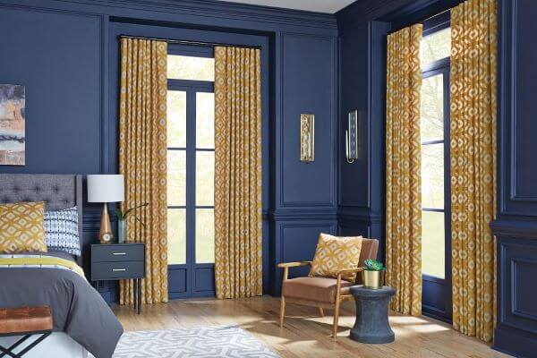 Adding floor length draperies may be the perfect addition to large picture windows to create a statement.