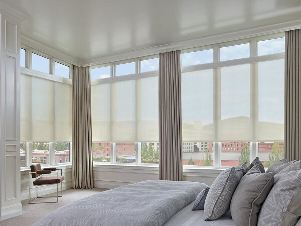Pair sheer window treatments with thicker fabrics or materials when layering more than one window treatment.