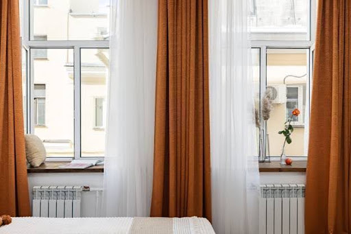 bedroom with sheer drapes
